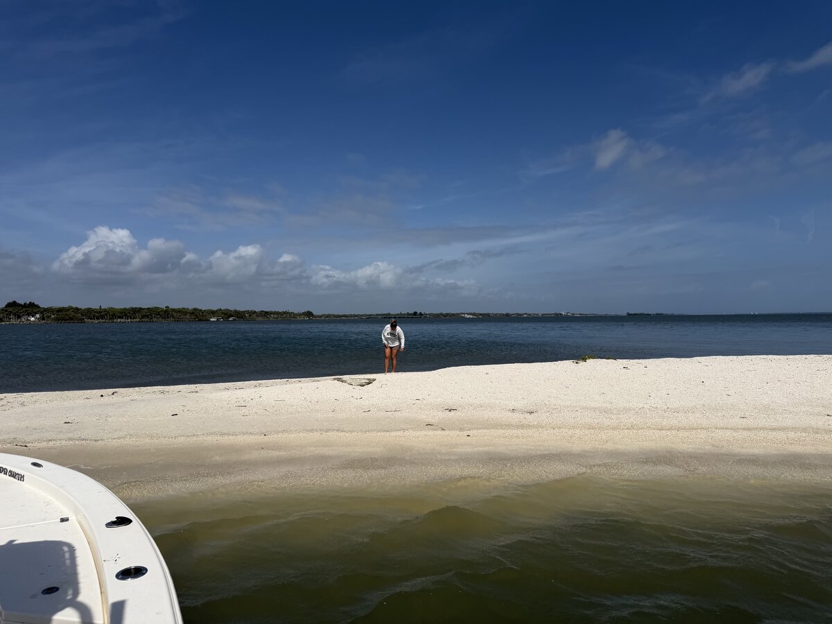 Guest exploring a secluded sandbar during a Zookeeper Charters trip near Sebastian Inlet